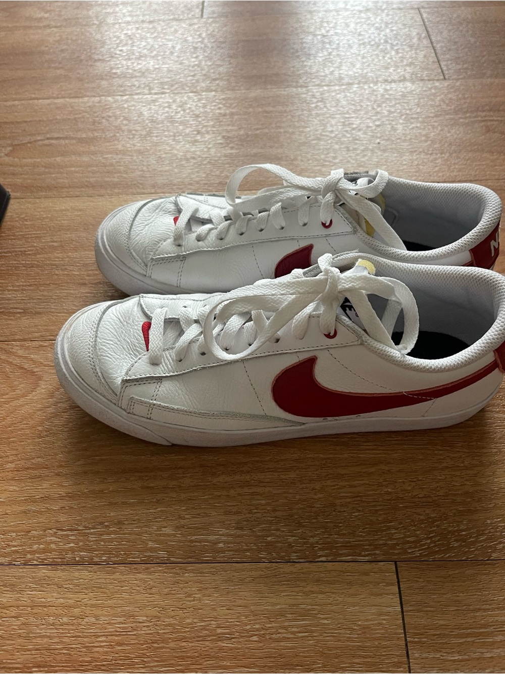 Nike White Sneakers with Red Swoosh